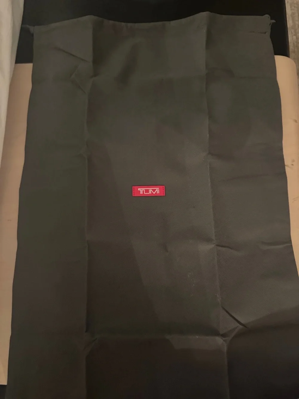 Tumi Black Dust Cover with Red Logo Patch